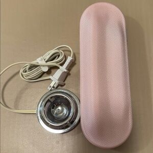 Pink Philips Sonicare toothbrush travel case and home charger